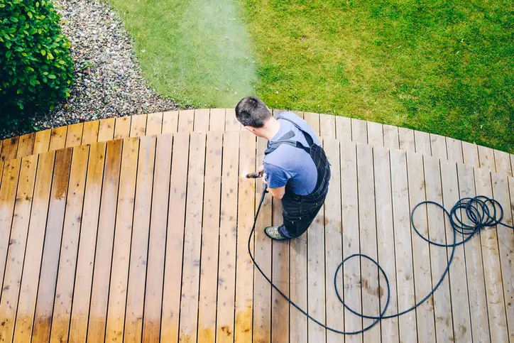 Five Star Deck Services power washing a back deck in Annapolis MD