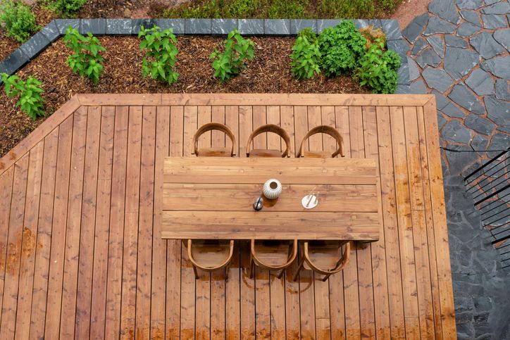 Top view of a wooden deck with chairs, illustrating deck restoration efforts in Annapolis, MD.
