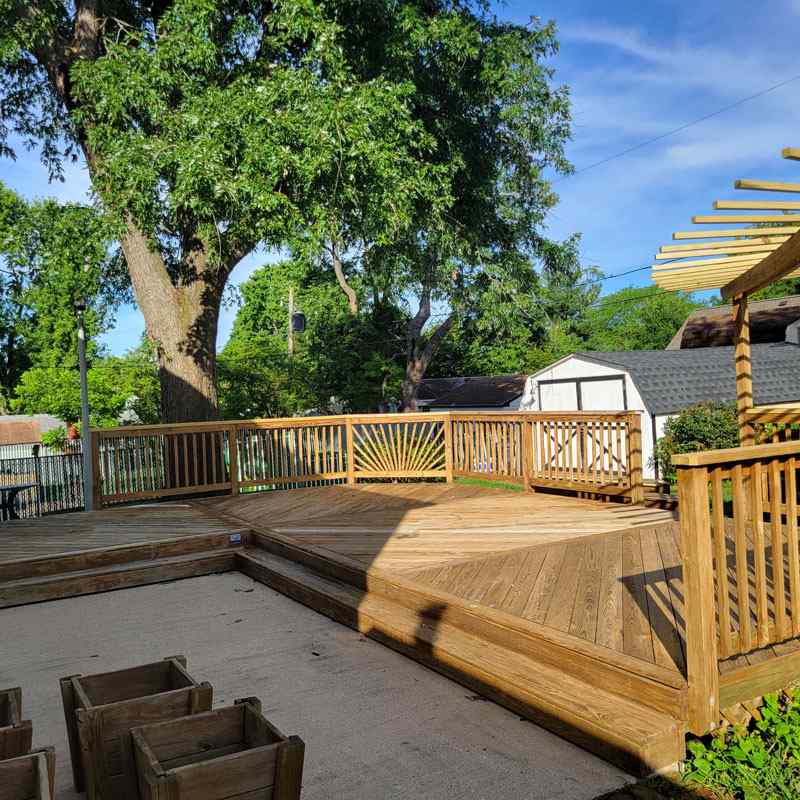 Demonstrating the importance of deck sanding for long-term maintenance in Annapolis, MD.