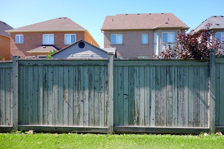 A Privacy Fence Surrounds a House in Annapolis, MD, with Lush Green Grass in the Foreground